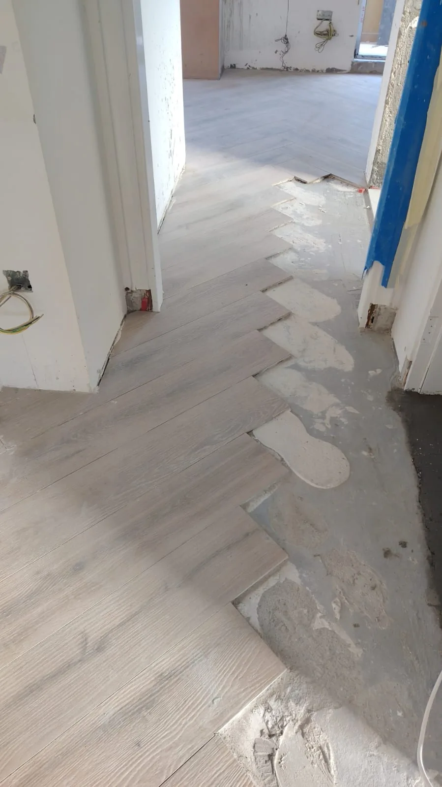 Flooring laid through a corridor in progress